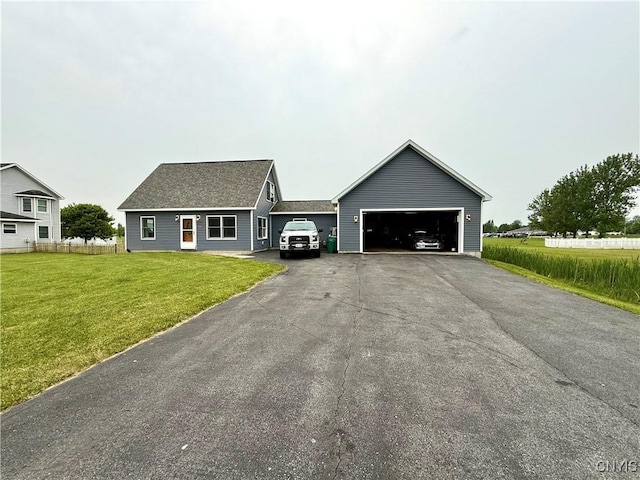 25003 State Route 37, Pamelia, NY 13601 - view of front of house with an attached garage, driveway, and a front lawn