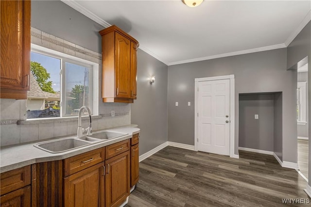614 20th St, Niagara Falls, NY 14301 - kitchen featuring a sink, tasteful backsplash, dark wood-type flooring, baseboards, and light countertops