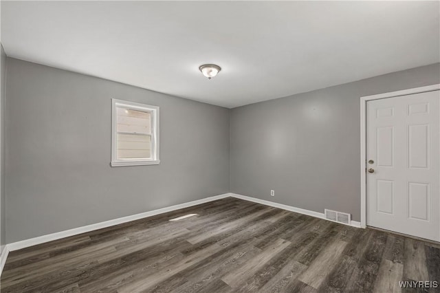 614 20th St, Niagara Falls, NY 14301 - empty room with dark wood-type flooring and baseboards