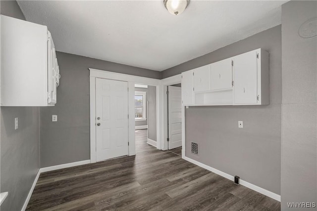 614 20th St, Niagara Falls, NY 14301 - laundry area featuring baseboards and dark wood-type flooring