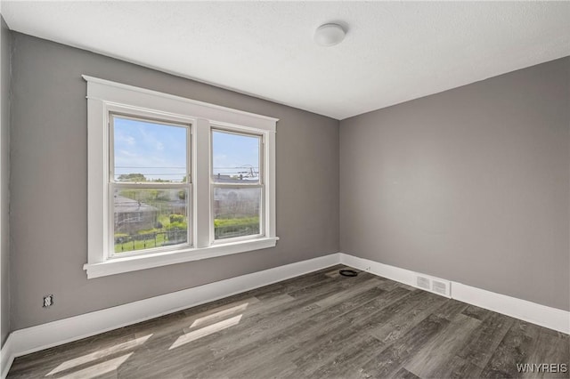 614 20th St, Niagara Falls, NY 14301 - empty room featuring wood finished floors and baseboards