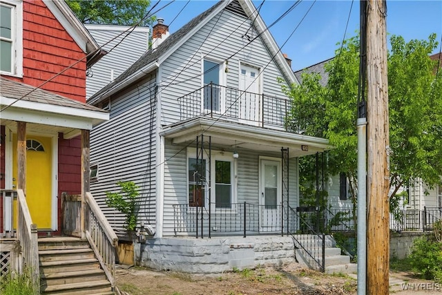 610 20th St, Niagara Falls, NY 14301 - view of front of property featuring covered porch, a balcony, and a chimney