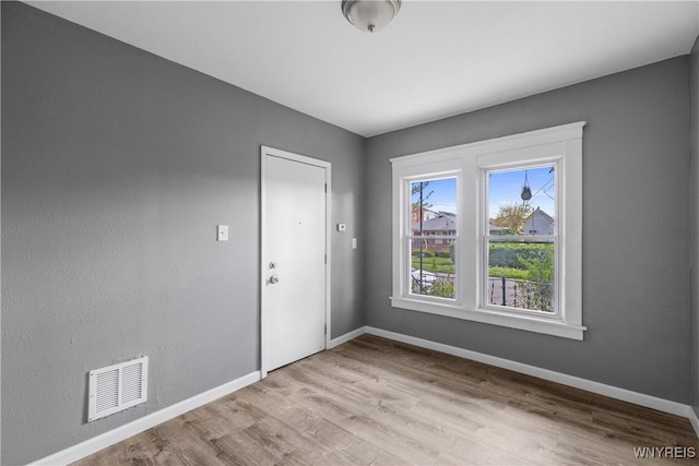 610 20th St, Niagara Falls, NY 14301 - spare room featuring baseboards and wood finished floors