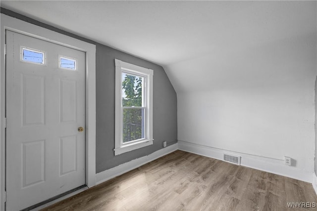 610 20th St, Niagara Falls, NY 14301 - additional living space featuring wood finished floors, lofted ceiling, and baseboards