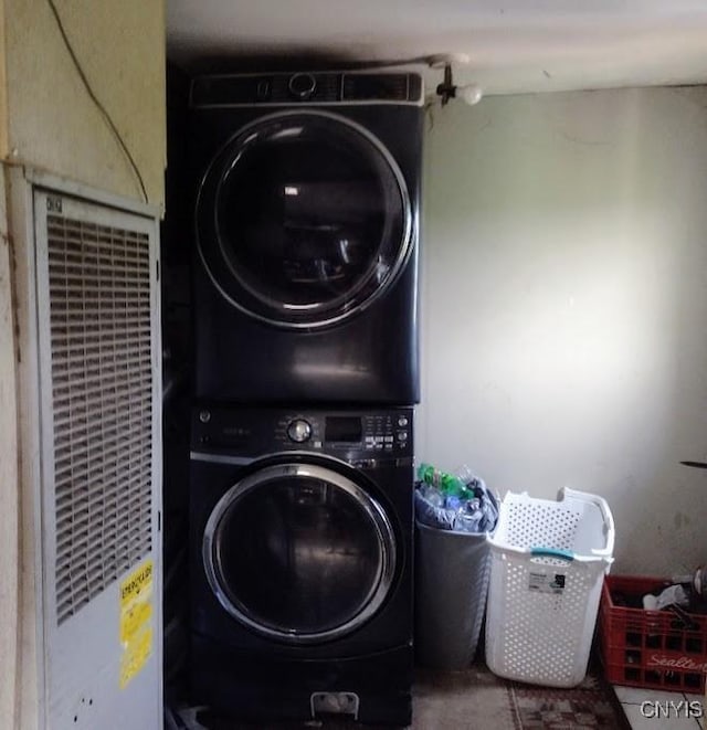2771 Center Rd, Freetown, NY 13045 - washroom featuring stacked washer and clothes dryer and a heating unit