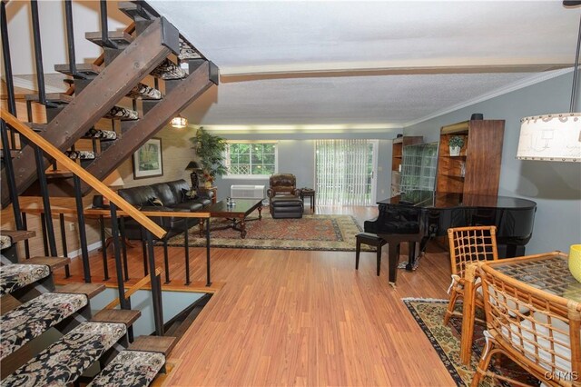 1215-29 James St, Syracuse, NY 13203 - living area with crown molding, stairway, and wood finished floors