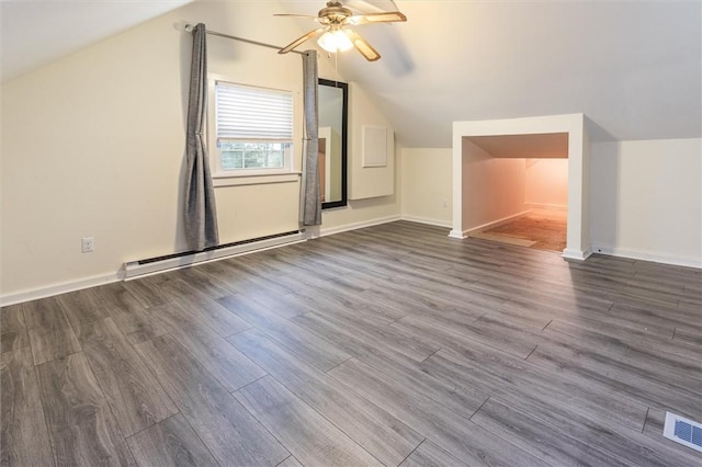 3215 E River Rd, Henrietta, NY 14623 - additional living space featuring a baseboard heating unit, vaulted ceiling, wood finished floors, ceiling fan, and baseboards