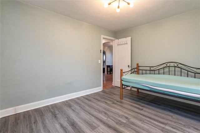 3215 E River Rd, Henrietta, NY 14623 - bedroom with wood finished floors and baseboards