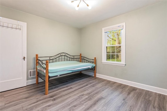 3215 E River Rd, Henrietta, NY 14623 - bedroom featuring wood finished floors and baseboards