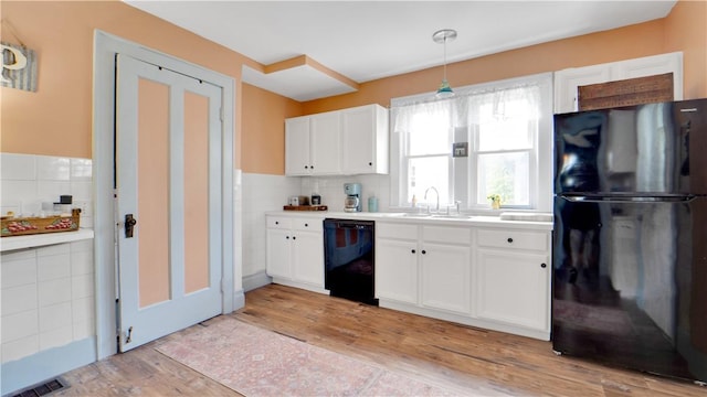 17 Varden St, Rochester, NY 14609 - kitchen featuring black appliances, a sink, white cabinets, and light wood-style flooring