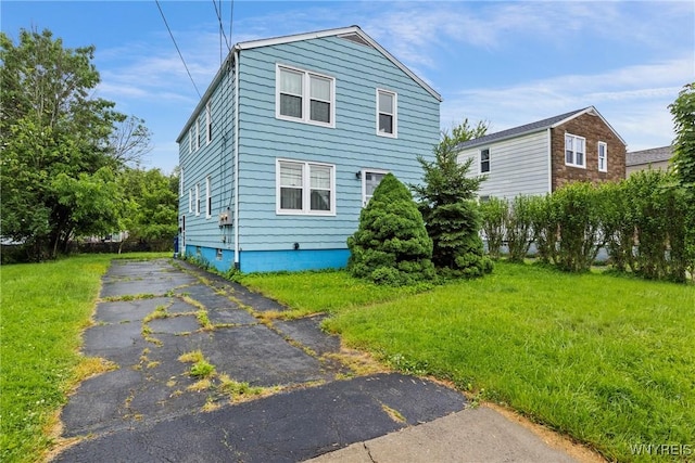 99 Kamper Ave, Buffalo, NY 14210 - view of side of home featuring a lawn