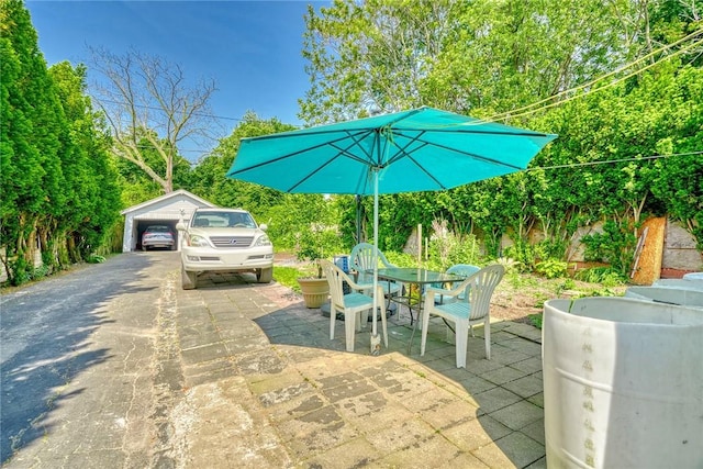 135 Cameron St, Rochester, NY 14606 - view of patio with an outbuilding and outdoor dining area