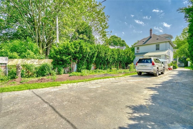 135 Cameron St, Rochester, NY 14606 - view of front facade with driveway and a chimney