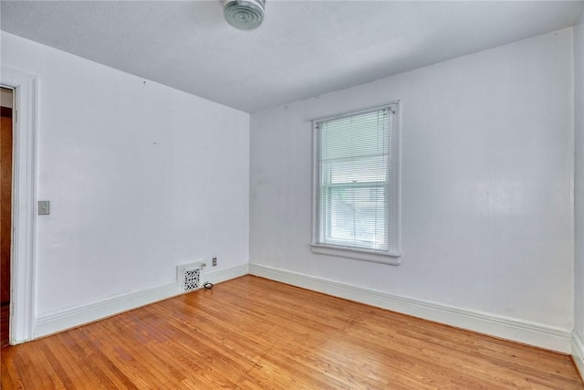 135 Cameron St, Rochester, NY 14606 - empty room with wood finished floors and baseboards