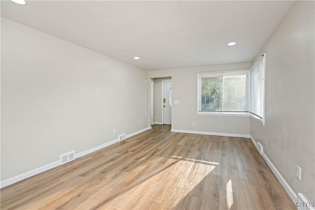 124 Aurora St, Rochester, NY 14621 - spare room with wood finished floors, baseboards, and recessed lighting