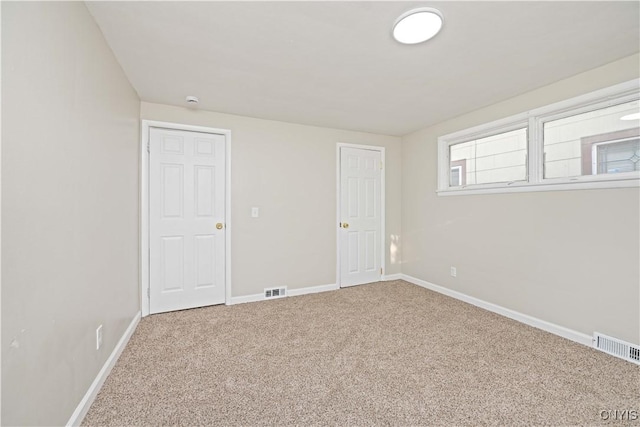 124 Aurora St, Rochester, NY 14621 - unfurnished bedroom with baseboards and carpet floors