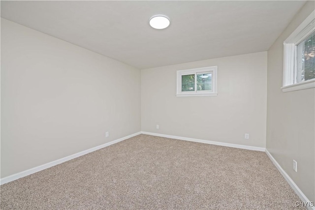 124 Aurora St, Rochester, NY 14621 - carpeted spare room featuring baseboards
