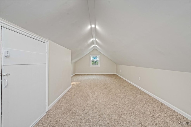 124 Aurora St, Rochester, NY 14621 - additional living space with lofted ceiling, baseboards, and carpet floors