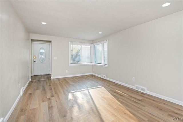 124 Aurora St, Rochester, NY 14621 - foyer with wood finished floors, baseboards, and recessed lighting