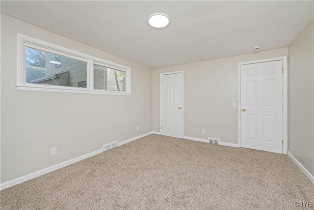 124 Aurora St, Rochester, NY 14621 - unfurnished bedroom featuring carpet and baseboards