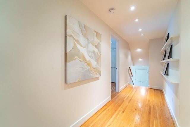 313 Pelham Rd, Brighton, NY 14610 - corridor with recessed lighting, wood finished floors, baseboards, and an upstairs landing