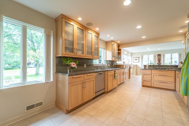 313 Pelham Rd, Brighton, NY 14610 - kitchen featuring appliances with stainless steel finishes, light tile patterned flooring, recessed lighting, backsplash, and glass insert cabinets