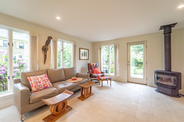 313 Pelham Rd, Brighton, NY 14610 - living area featuring a wood stove, plenty of natural light, and recessed lighting