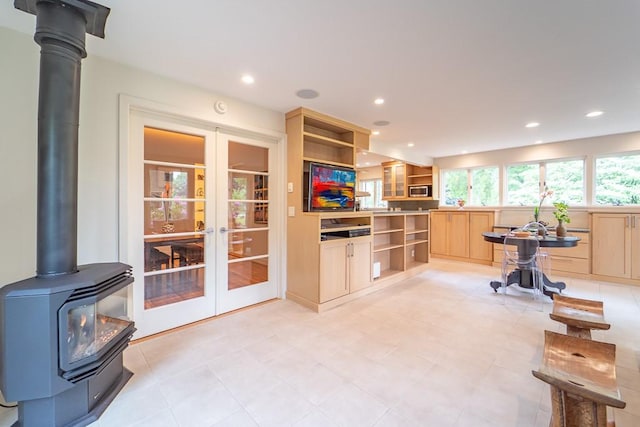 313 Pelham Rd, Brighton, NY 14610 - kitchen featuring open shelves, light brown cabinetry, french doors, a wood stove, and recessed lighting
