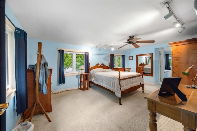 15205 W Lake Rd, Pulteney, NY 14418 - bedroom with rail lighting, light carpet, and ceiling fan