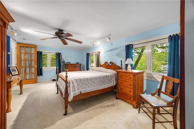 15205 W Lake Rd, Pulteney, NY 14418 - carpeted bedroom with french doors, track lighting, and ceiling fan