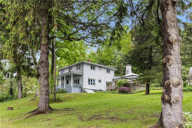 15205 W Lake Rd, Pulteney, NY 14418 - view of front of home featuring a chimney and a front lawn