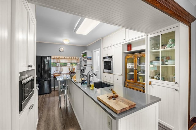15205 W Lake Rd, Pulteney, NY 14418 - kitchen with appliances with stainless steel finishes, dark wood-style flooring, white cabinetry, a kitchen island with sink, and crown molding