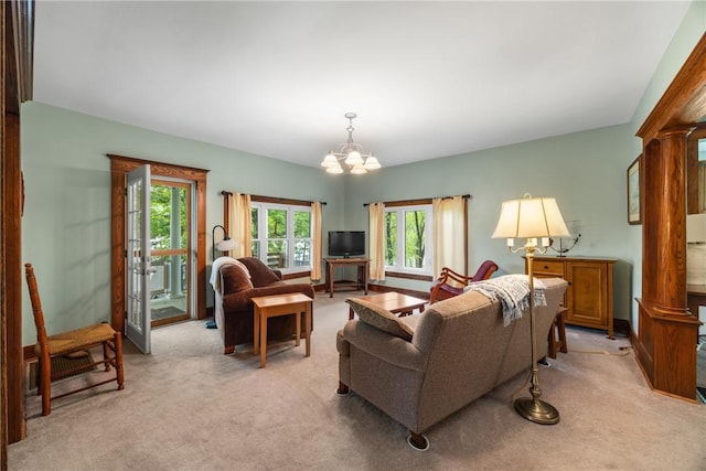 15205 W Lake Rd, Pulteney, NY 14418 - living room with light colored carpet, a chandelier, and ornate columns