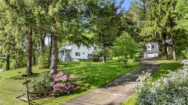 15205 W Lake Rd, Pulteney, NY 14418 - view of grassy yard with a garage and driveway