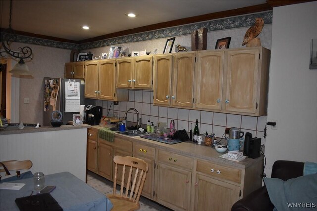 4571 Budd Rd, Cambria, NY 14094 - kitchen featuring freestanding refrigerator, decorative backsplash, light countertops, and a sink