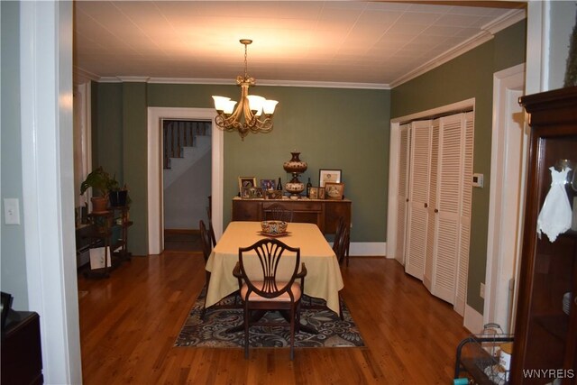 4571 Budd Rd, Cambria, NY 14094 - dining space featuring a chandelier, wood finished floors, ornamental molding, and stairs