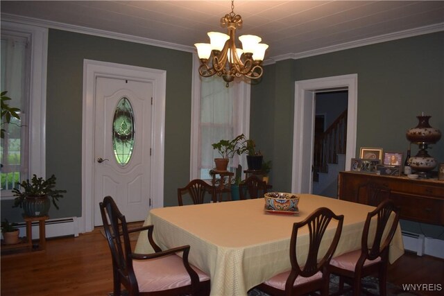 4571 Budd Rd, Cambria, NY 14094 - dining space featuring a chandelier, a baseboard radiator, dark wood-style floors, stairway, and ornamental molding
