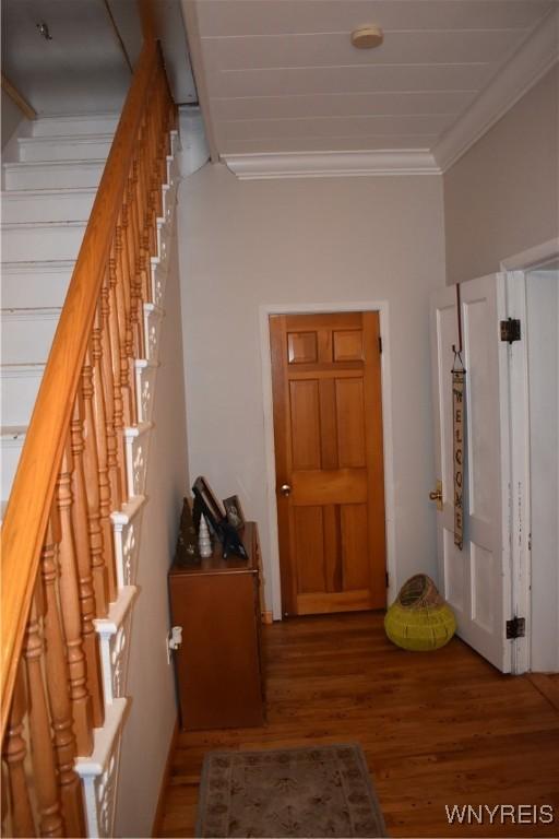 4571 Budd Rd, Cambria, NY 14094 - hall featuring ornamental molding, wood finished floors, and stairway