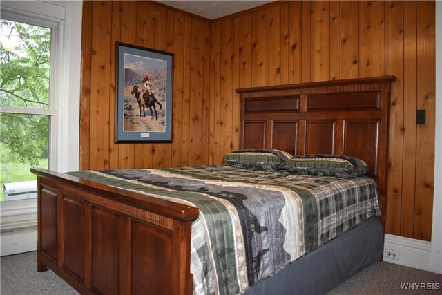 4571 Budd Rd, Cambria, NY 14094 - bedroom featuring carpet flooring and wood walls