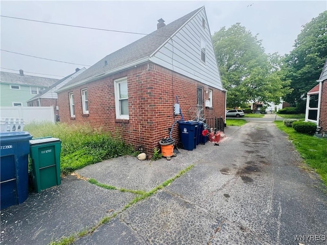57 Erskine Ave, Buffalo, NY 14215 - view of home's exterior featuring brick siding and a chimney