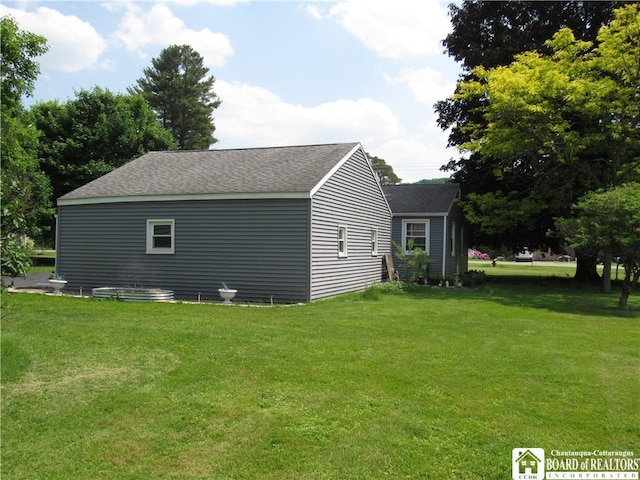 23 Frew Run St, Carroll, NY 14738 - view of side of property featuring a yard and roof with shingles