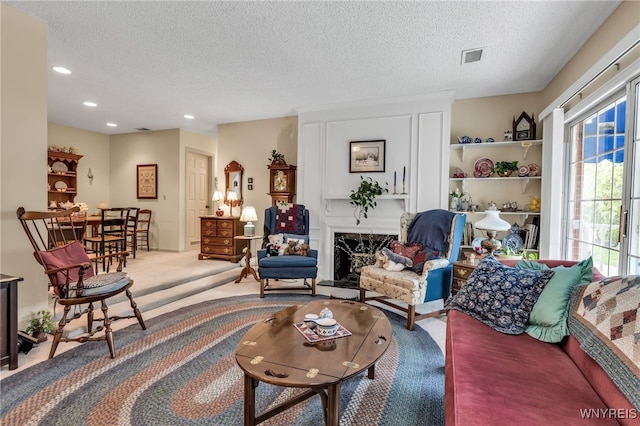 108 Hickory Hill Rd Unit H, Amherst, NY 14221 - living room with a textured ceiling, recessed lighting, carpet, and a high end fireplace