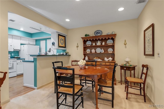 108 Hickory Hill Rd Unit H, Amherst, NY 14221 - dining room featuring light carpet, recessed lighting, and baseboards