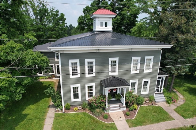 4937 W Seneca, Onondaga, NY 13215 - view of front of home with metal roof, a front lawn, a gazebo, and view of wooded area