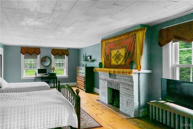 4937 W Seneca, Onondaga, NY 13215 - bedroom featuring hardwood / wood-style flooring and a fireplace