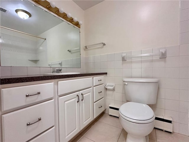 2501 E Ave, Brighton, NY 14610 - bathroom with baseboard heating, tile patterned floors, vanity, toilet, and a baseboard heating unit