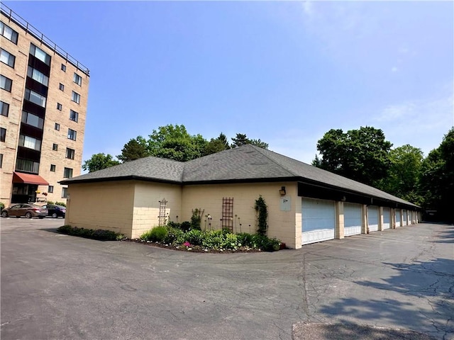 2501 E Ave, Brighton, NY 14610 - view of property exterior featuring community garages