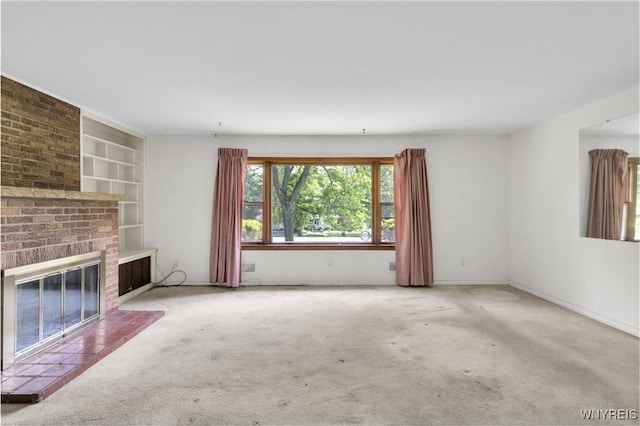 1701 Billington Rd, Elma, NY 14052 - unfurnished living room featuring carpet flooring, built in shelves, and a fireplace