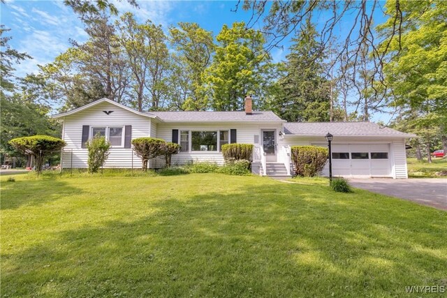 1701 Billington Rd, Elma, NY 14052 - view of front of property with an attached garage, driveway, a chimney, and a front yard