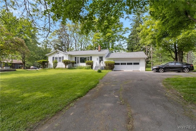 1701 Billington Rd, Elma, NY 14052 - view of front facade featuring asphalt driveway, a garage, a chimney, and a front yard